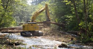 0913_Habitat_Restoration_01 Logs are stacked during the construction of a logjam in Still Creek, near Rhododendron, last month. (Sam Tenney/DJC)