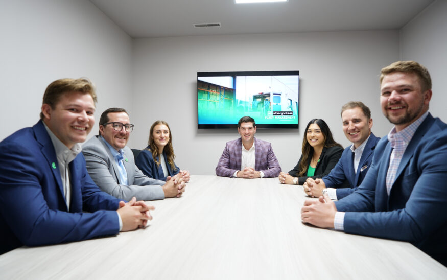 The staff of Enterprise Fleet Management in Boise gather in the conference room. (PHOTO: Marc Lutz, IBR)