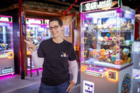 Susie Gillikin stands in the midst of several gashapon machines at ISEKAI Japanese Arcade & Gashapon in Boise. (PHOTO: PRISCILLA GROVER)