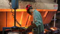 A worker pours hot metal at the Kirsh Foundry in Beaver Dam, Wisconsin, U.S., April 12, 2018. (PHOTO: REUTERS/Timothy Aeppel)