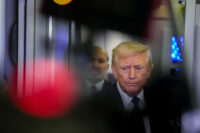 U.S. President Donald Trump looks on as he speaks with members of the media on board Air Force One en route to Palm Beach, Florida, U.S., February 6, 2026. (PHOTO: REUTERS/Ken Cedeno/File Photo)