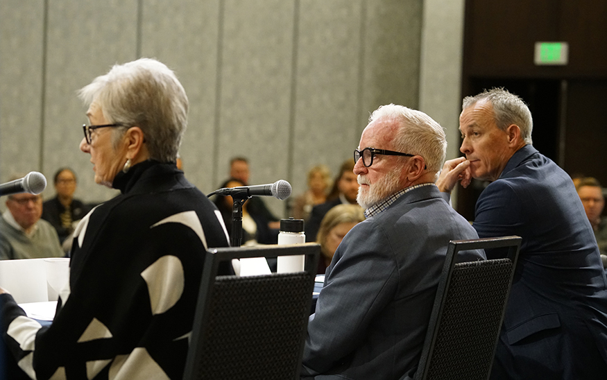 Jan Rogers, left, speaks to the audience at the Breakfast Series panel discussion while Clark Krause, executive director at Boise Valley Economic Partnership, and Mel Jackson listen. (PHOTO: MARC LUTZ, IBR)