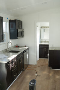 The kitchen of the homes is directly across from the front door and next to the bathroom. (PHOTO: MARC LUTZ, IBR)