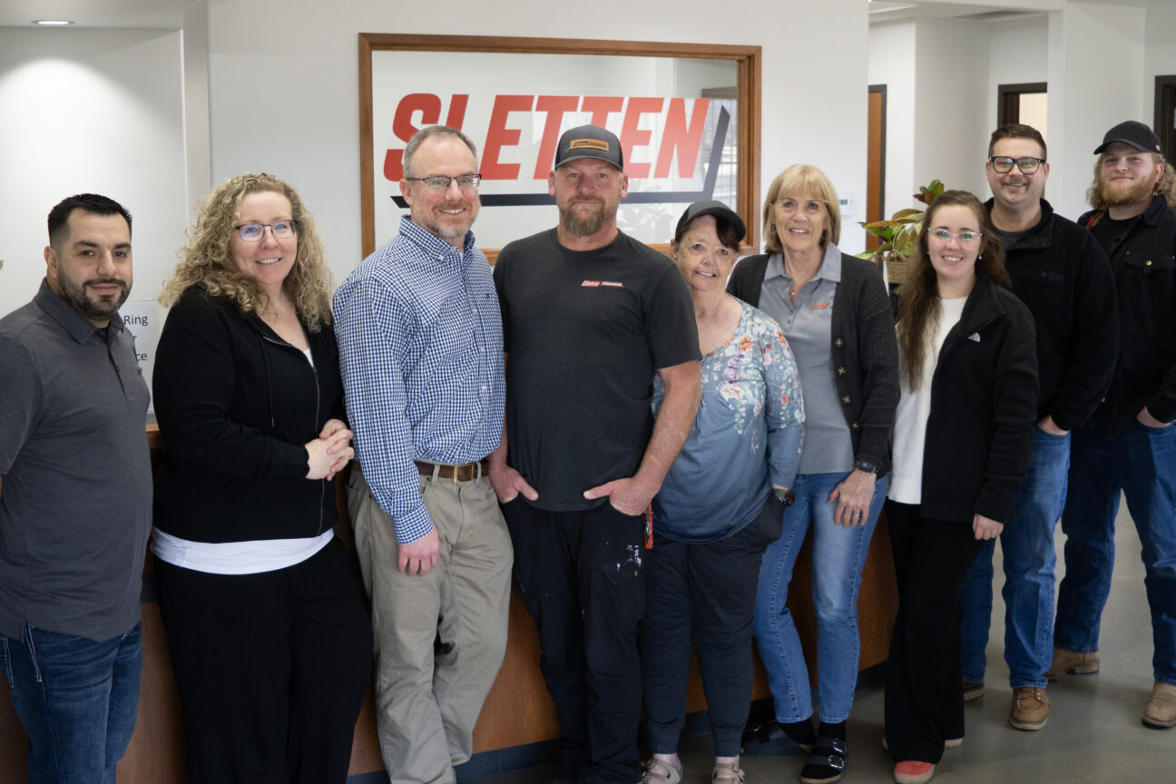 Employees at the Sletten Construction Idaho branch include, from left, Thomas Briseño, Lisa Anthony, Bill Sharp, Greg Borg, Dee Fullington, Kelly Reynolds, Monteen-alyse Ebert, Allen Karadza and Calvin Michaels. (PHOTO: MARC LUTZ, IBR)