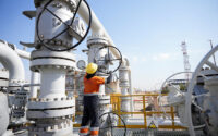 A worker operates valves at the Rumaila oil field, as the country cuts nearly 1.5 million barrels per day of output amid halted exports following the closure of the Strait of Hormuz, in Basra, Iraq, March 4, 2026. (PHOTO: REUTERS/Essam Al-Sudani/File Photo)