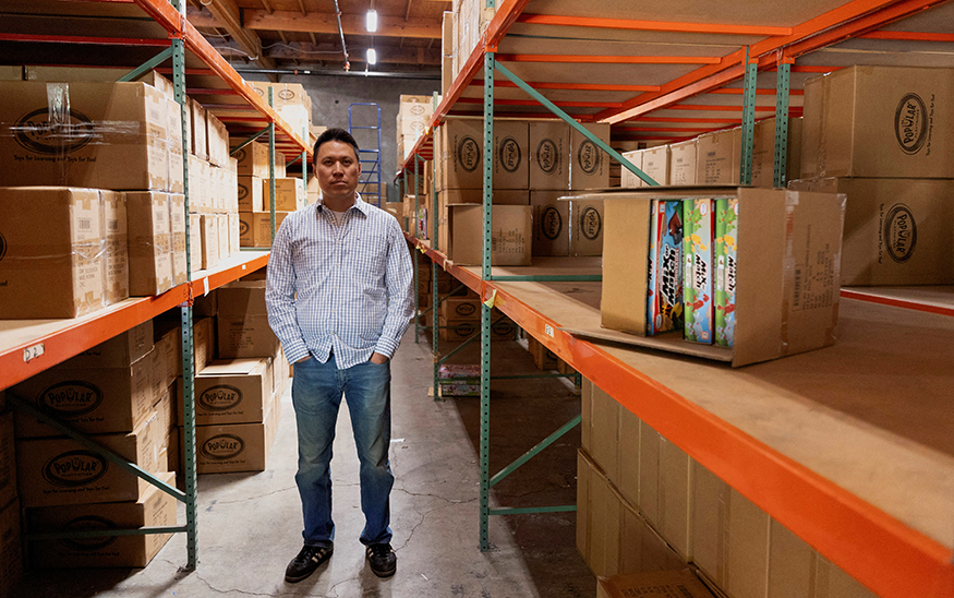 CEO Jason Cheung of toy manufacturer Huntar Company Inc poses amongst partially empty shelves at the U.S. office in Union City, California, on May 8, 2025. (PHOTO: REUTERS/Brittany Hosea-Small/File Photo)