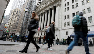 People walk on Wall Street in front of the New York Stock Exchange (NYSE) in New York on Feb. 6, 2018. (PHOTO: REUTERS/Brendan McDermid/File)