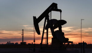 A drone view of a pump jack and drilling rig south of Midland, Texas, on June 11, 2025. (PHOTO: REUTERS/Eli Hartman/File)