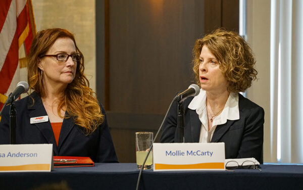 Mollie McCarty, chief external affairs officer for the Idaho Transportation Department, right, talks about the need for a consistent budget for the state's transportation infrastructure while Lisa Raye Anderson listens. (PHOTO: MARC LUTZ, IBR)