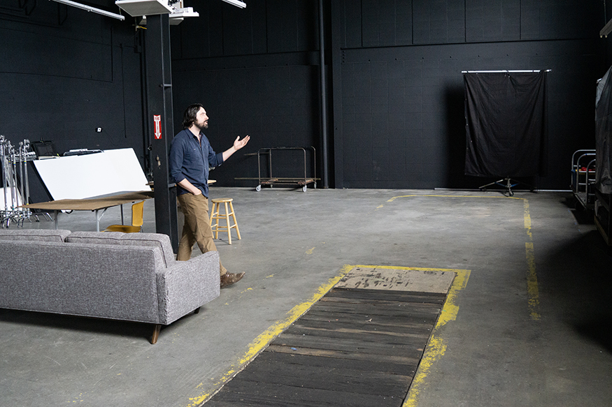 Brezonick talks about the sound stage at IFS, which was once a mechanic's bay. (PHOTO: MARC LUTZ, IBR)