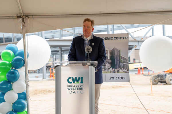Gordon Jones, president of College of Western Idaho, speaks at a recent name gifting event at its new academic construction site in Boise. The school will be named after longtime education partner Micron Technology. (PHOTO: CWI)
