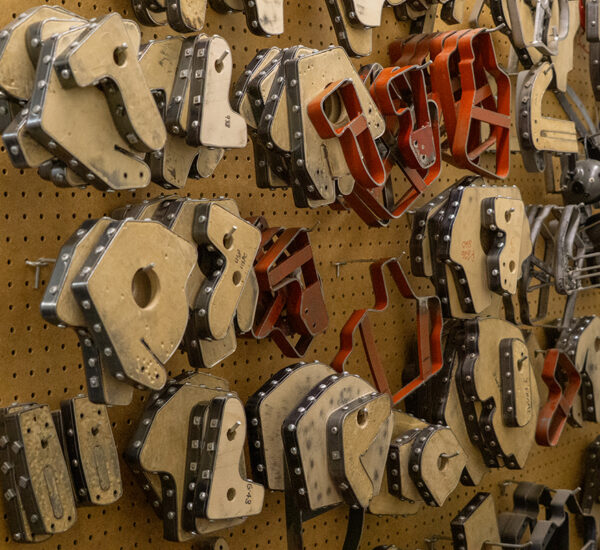 A large variety of die cuts hang on a wall of the Milt Sparks Holster company in Garden City. The cuts are used to create the initial layout of custom holsters made at the business. (PHOTO: MARC LUTZ, IBR)