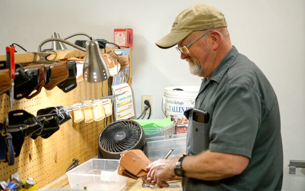 Jim Wall, a partner and the shop manager at Milt Sparks Holsters, works on a custom job. (PHOTO: MARC LUTZ, IBR)