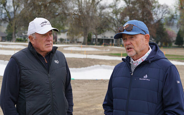 Will Gustafson, owner of The River Club, left, listens as Curley talks about the remodel of the club's golf course. (PHOTO: MARC LUTZ, IBR)