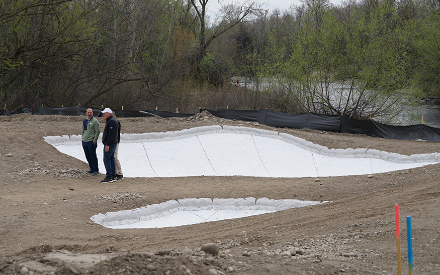 Huston, Gustafson and Johnson walk along the 18th hole of The River Club golf course, which has been raised up, allowing golfers to see the Boise River flowing along the backside of the property. The river was previously hidden from view as the course was much lower. (PHOTO: MARC LUTZ, IBR)
