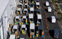 Workers load vans with packages at an Amazon fulfillment center in Valencia, California, Dec. 4, 2025. (PHOTO: REUTERS/Daniel Cole/File)
