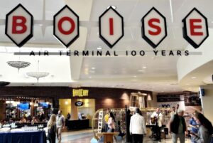 A sign at the airport lauds the travel hub's 100-year anniversary. (PHOTO: STEVE LOMBARD, IBR)