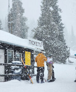 Skiers purchase lift tickets during a snowstorm at the resort in Albion, Idaho. (PHOTO: POMERELLE)