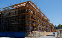 A construction worker is shown on the job site at a multi-unit residential housing project in Encinitas, California, on July 28, 2025. (PHOTO: REUTERS/Mike Blake/File)