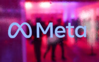 People walk behind a logo of Meta Platforms company, during a conference in Mumbai, India, on Sept. 20, 2023. (PHOTO: REUTERS/Francis Mascarenhas/File)