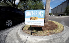 A Cracker Barrel restaurant displays a "Now Hiring" sign in Tampa, Florida, on June 1, 2021. (PHOTO: REUTERS/Octavio Jones/File)