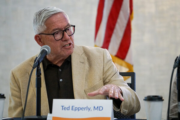 Dr. Ted Epperly speaks about the problems that led to a shortage of health care workers. (PHOTO: MARC LUTZ, IBR)