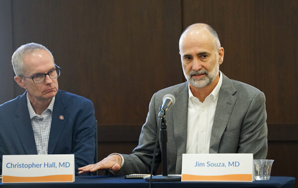 Dr. Christopher Hall of Saint Alphonsus listens while Dr. Jim Souza of St. Luke's answers a question during the discussion.(PHOTO: MARC LUTZ, IBR)