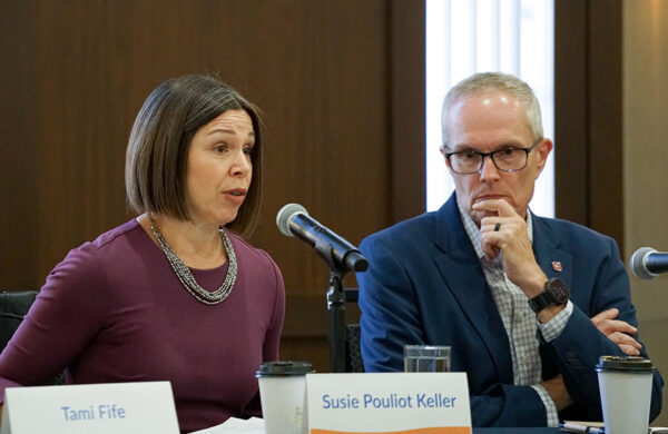 Susie Keller talks about the impact of less health care workers on businesses while Dr. Christopher Hall listens. (PHOTO: MARC LUTZ, IBR)