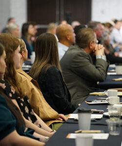 The third installment of five panel discussions had a packed room. The event, attended by businesses and those in the health care industry, sold out. Many in attendance were taking notes and listening intently as panelists spoke. (PHOTO: MARC LUTZ, IBR)