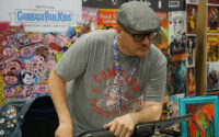Artist Jeff Cox listens to an attendee at Gem State Comic Con on May 15 in Garden City. Cox and other artists and vendors were on hand to make connections with fans and sell products. (PHOTO: MARC LUTZ, IBR)