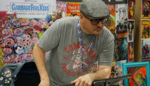 Artist Jeff Cox listens to an attendee at Gem State Comic Con on May 15 in Garden City. Cox and other artists and vendors were on hand to make connections with fans and sell products. (PHOTO: MARC LUTZ, IBR)