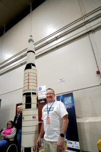 Greg Fastabend, founder and president of Idaho LUG (LEGO Users Group) stands with a rocket his organization made. The project was made in three days by 1,500 elementary school kids and used 40,000 bricks to complete. (PHOTO: MARC LUTZ, IBR)
