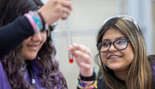 Students examine a sample during a hands-on lab activity at INL’s My Amazing Future event, where interactive experiments help connect classroom science to real-world applications. (PHOTO: INL)