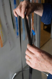 A strip of film displays a slightly different image in each frame. Larsen splices the strips connects them into loops, designing new images and teaching others how to do the same, unlocking creativity. (PHOTO: MARC LUTZ, IBR)