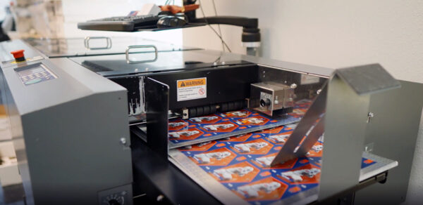 A machine prints ONIT's trading cards at its facility in Boise. (PHOTO: ONIT)