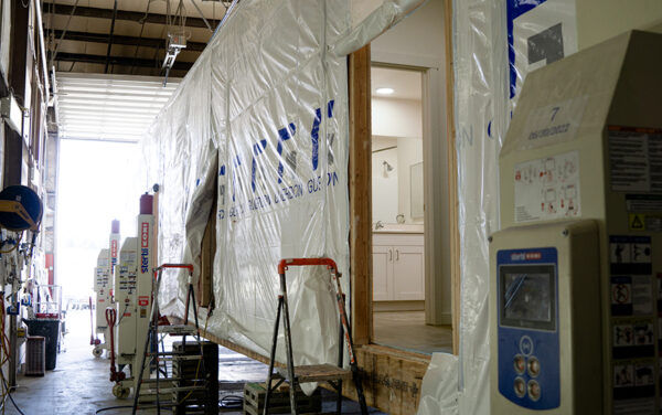 Structures are wrapped and prepped before being loaded onto the back of a trailer to be hauled the project sites in other states. (PHOTO: MARC LUTZ, IBR)