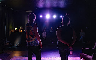 Jairom Barnett, left, and Abigail Wells work on a scene in front of fellow clients. (PHOTO: KEARNEY THOMPSON)