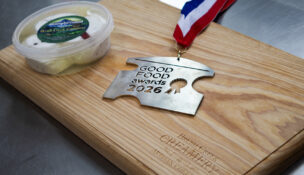 Labneh cheese made by Brush Creek Creamery in Deary using milk from the University of Idaho Dairy Center is displayed beside the top prize it recently won at the June 28 Good Food Awards ceremony in New York. (PHOTO: HANNA RUTH PETTYJOHN, VIA U OF I)