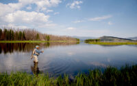 A man fishes in the Henry’s Fork of the Snake River. The lodge gives visitors a carefee, luxury experience. (PHOTO: HENRY’S FORK LODGE)